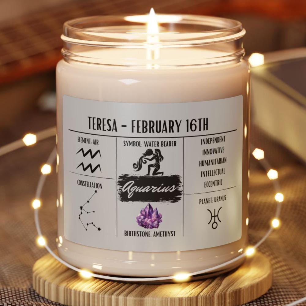 A personalized Aquarius zodiac candle with a clear lid, natural wax color, and printed label featuring the Aquarius constellation and birth information.